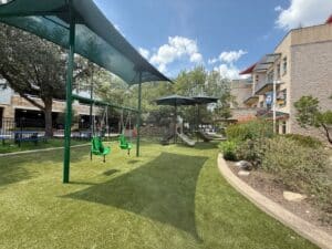 Shade structure over swing set
